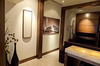 Acoustic Wall Art and Curve Low-Profile Diffusors on wall in Family Room